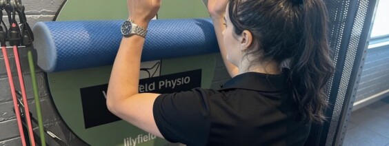 Niamh demonstrating how to perform shoulder physio exercises