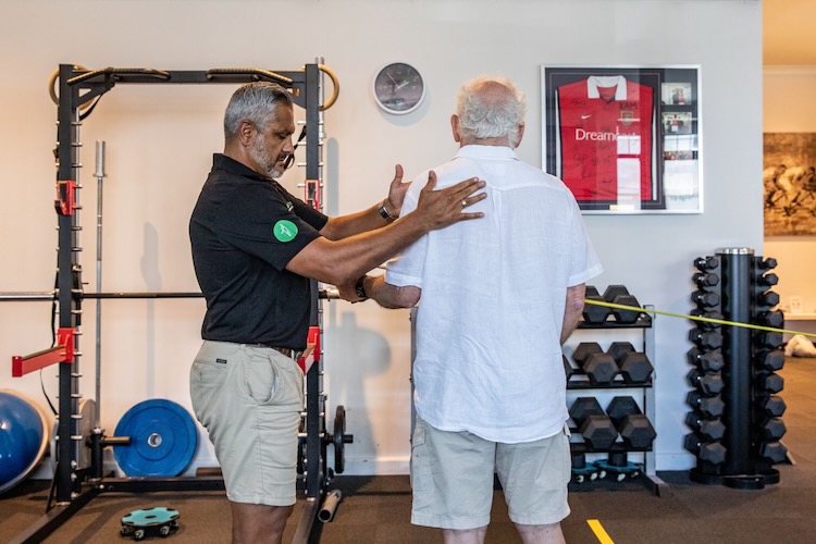 Kam with an osteoarthritis patient during an exercise