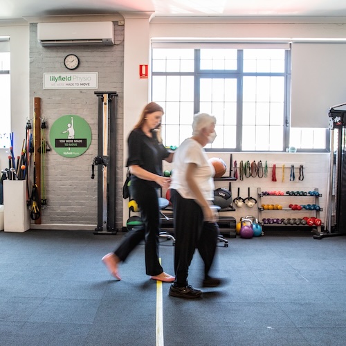 Karen with an osteoarthritis physio patient doing walking exercises