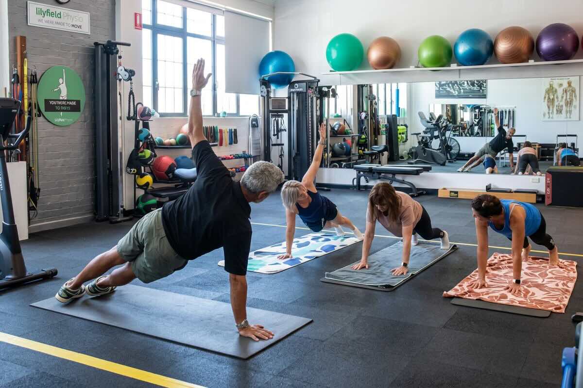Kam leading a group physiotherapy class
