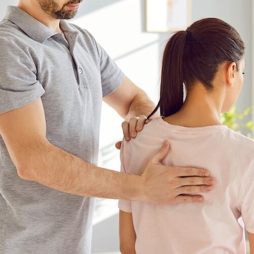 scoliosis-physio-manual-therapy Physio giving manual therapy to a woman with scoliosis